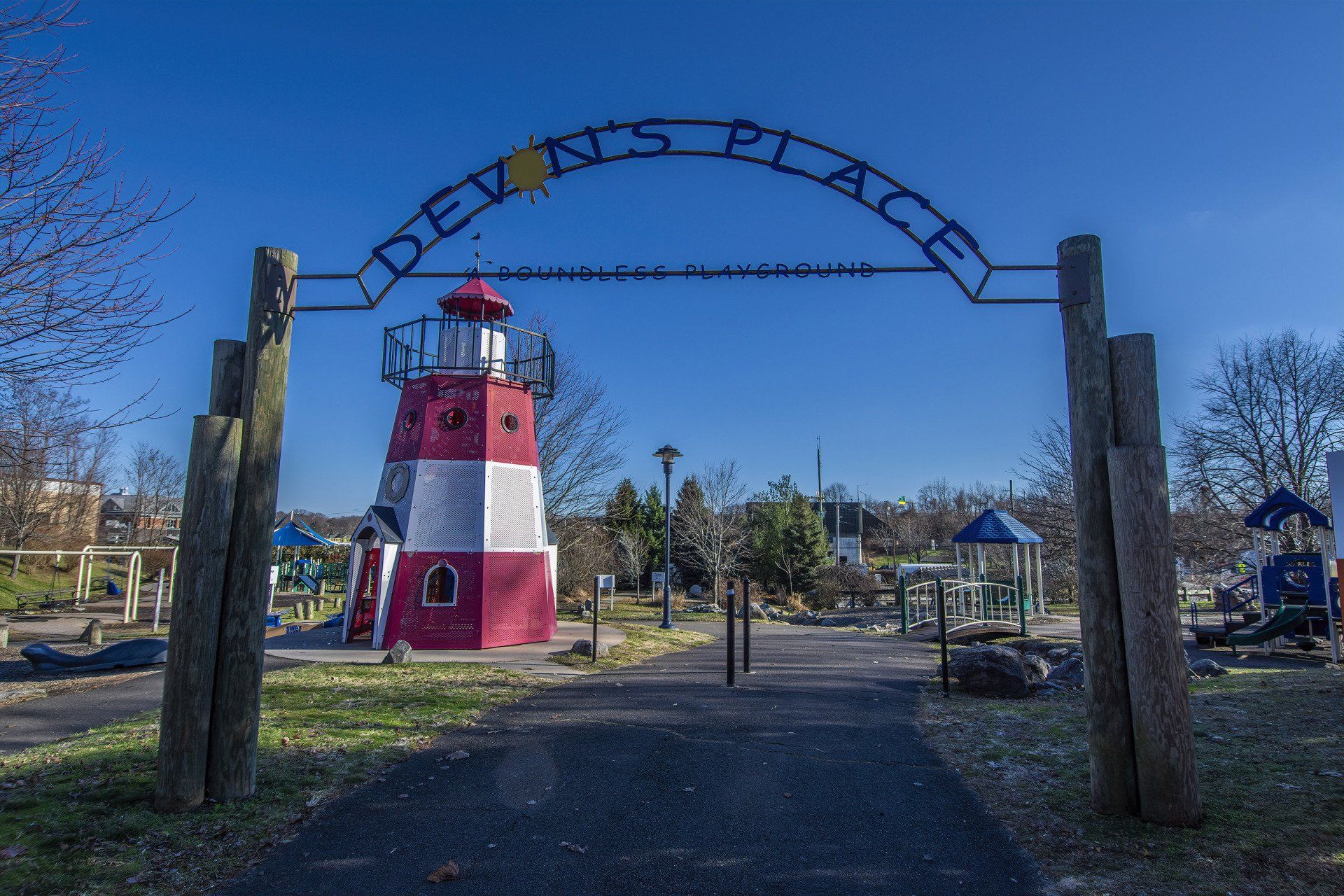 An arched metal entrance sign for