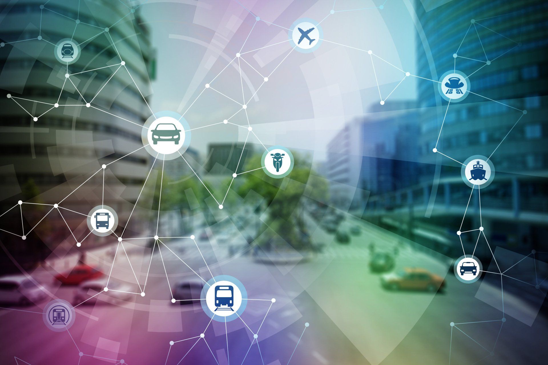 A network of transportation icons overlaid on a blurry urban street scene, representing connected smart mobility.