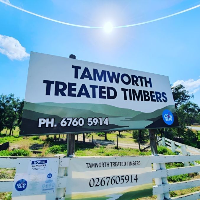 A Sign That Says Tamworth Treated Timbers On It — McKnight Signs In Armidale, NSW