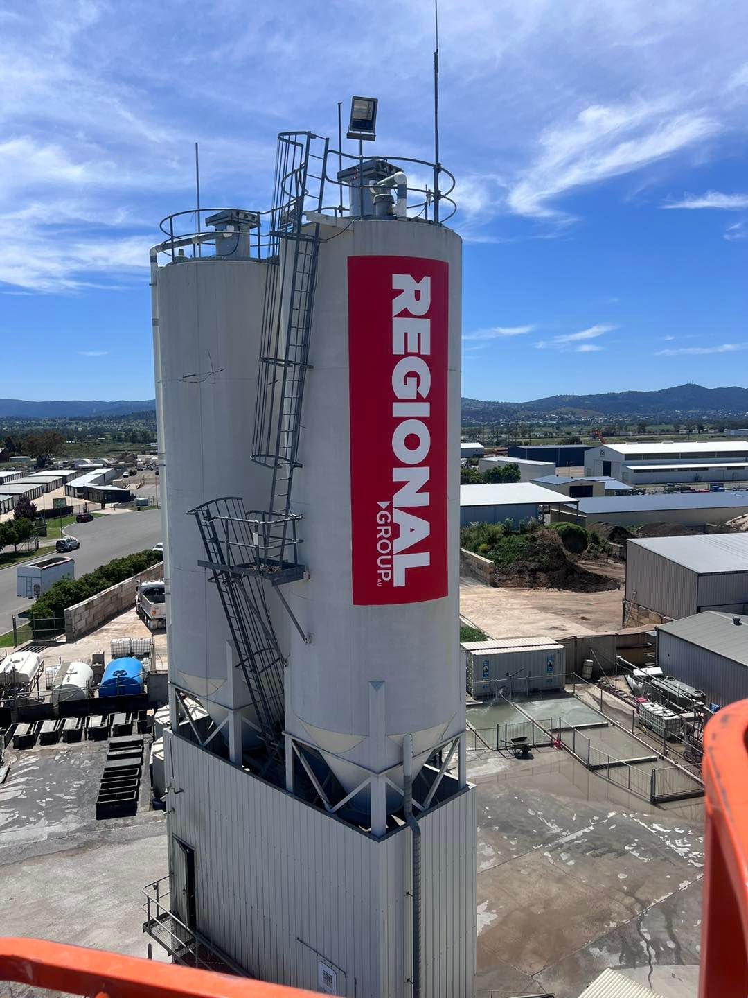 A Large White Building With A Red Sign That Says Regional — McKnight Signs In Hillvue, NSW