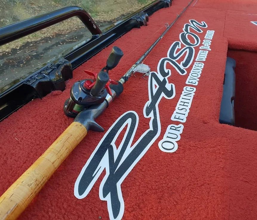 A Fishing Rod Is Sitting On A Boat That Says Our Fishing — McKnight Signs In Gunnedah, NSW