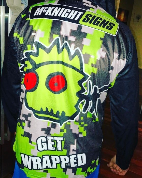 A Person Wearing A Shirt That Says Get Wrapped — McKnight Signs In Hillvue, NSW