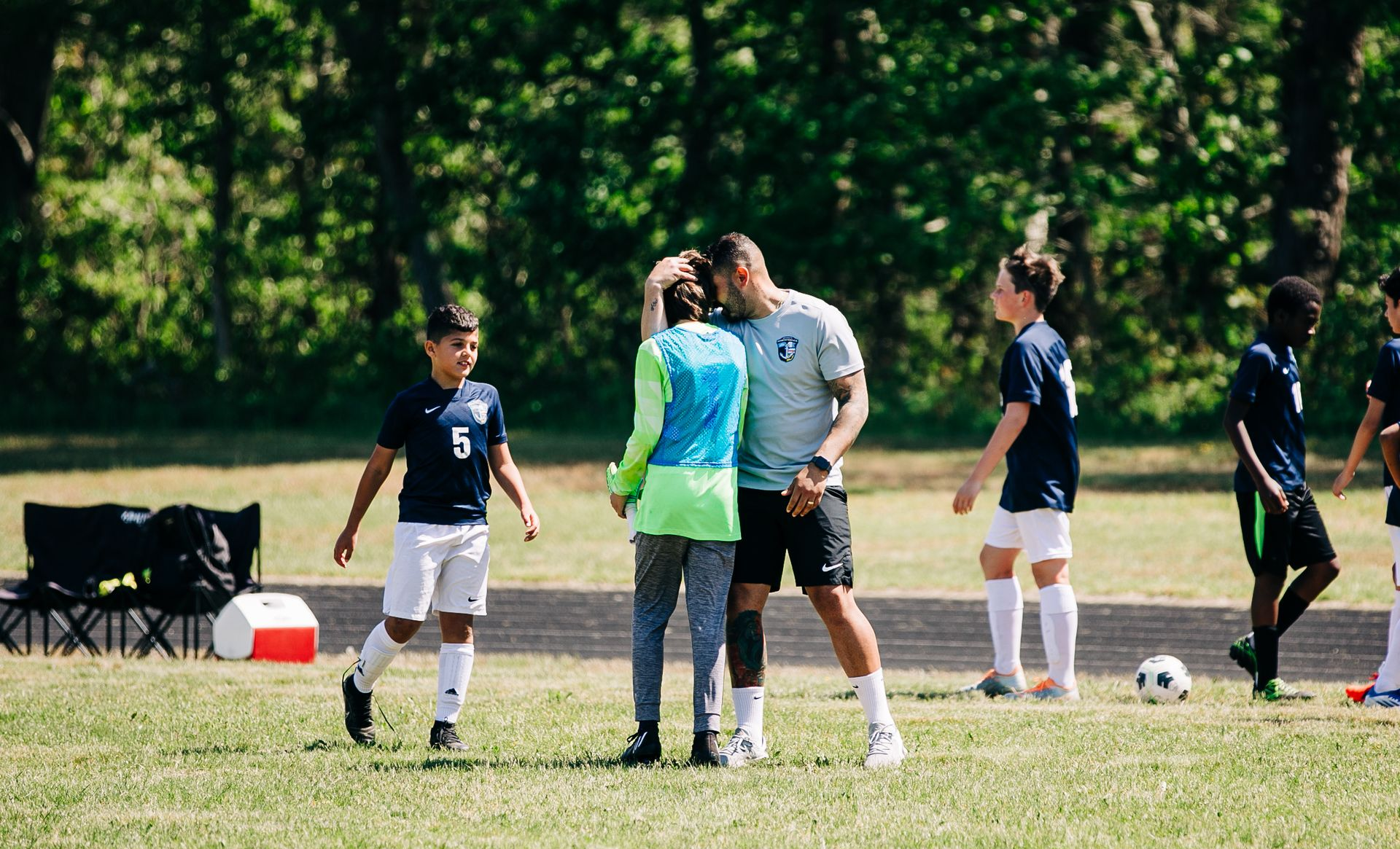 Coach Matheus offering support.