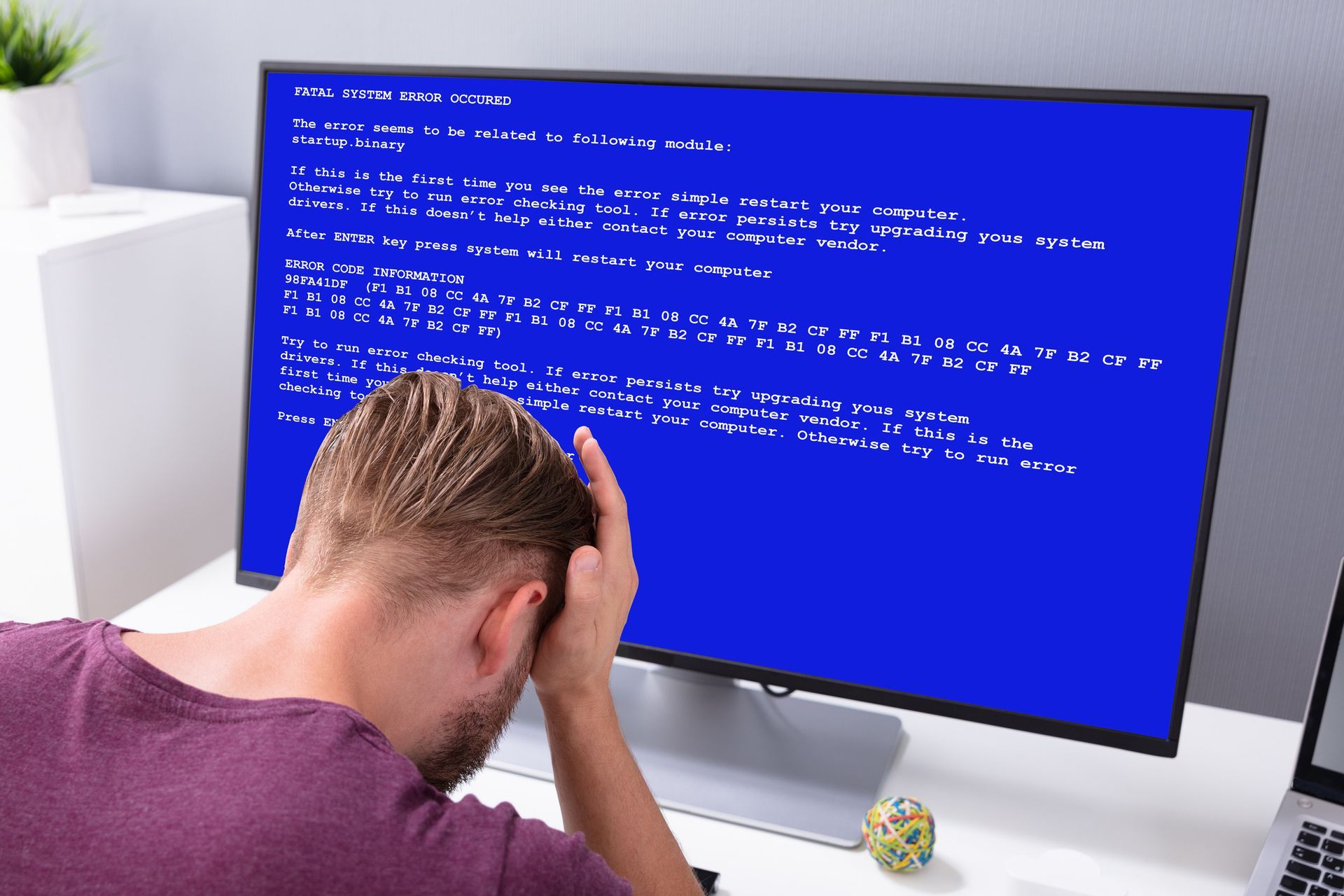 Technician in Zephyrhills repairing a βhauntedβ desktop computer during Halloween season.