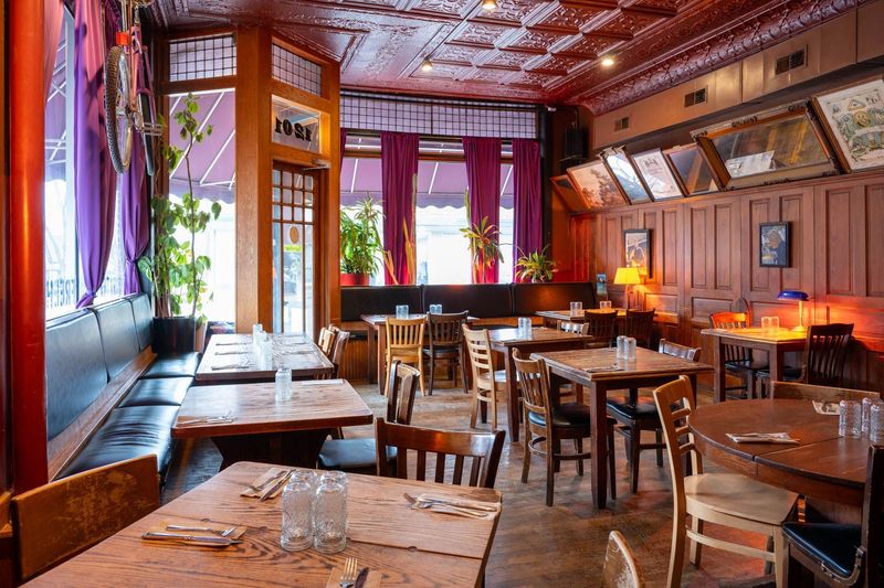 The dining room with its tin ceiling and velvet curtains