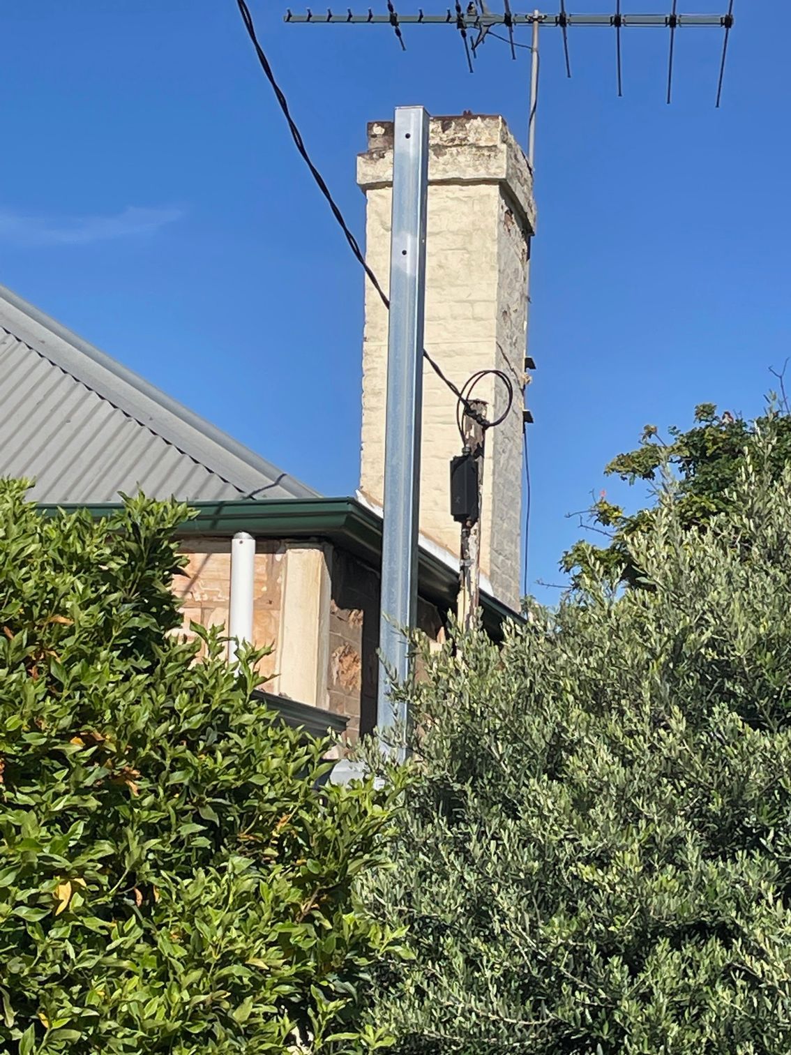 Brick Chimney Behind a Metal Pole — Nuriootpa, SA — Sparky's A Class Electrical