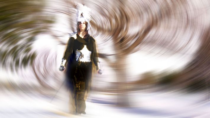 A blurry picture of a person standing in the snow.