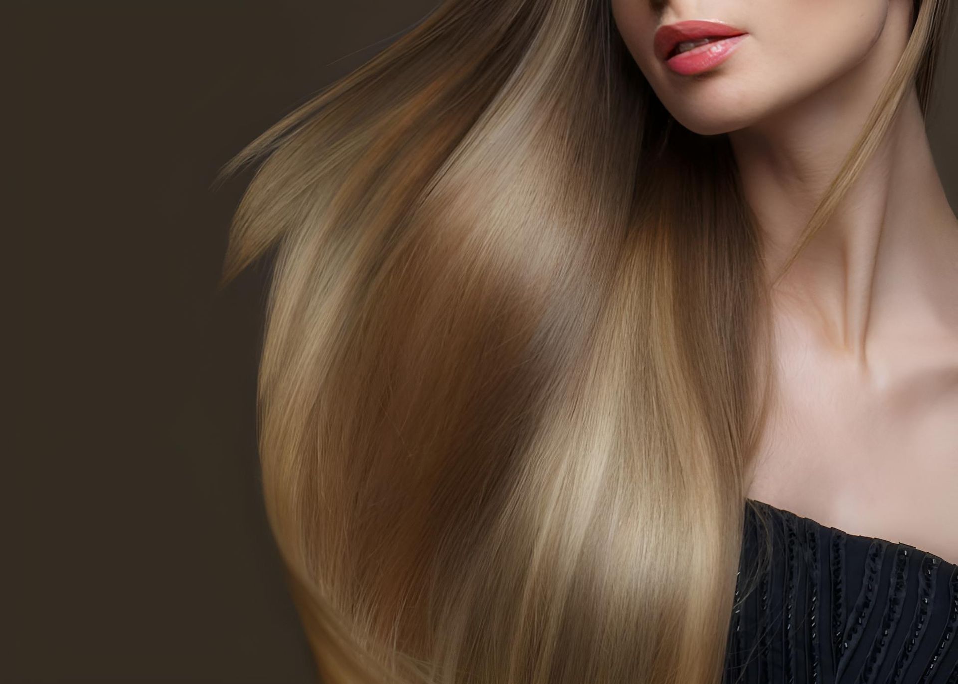 A Woman With Long Blonde Hair is Wearing a Black Top — Strut Hair & Beauty In Maroochydore, QLD