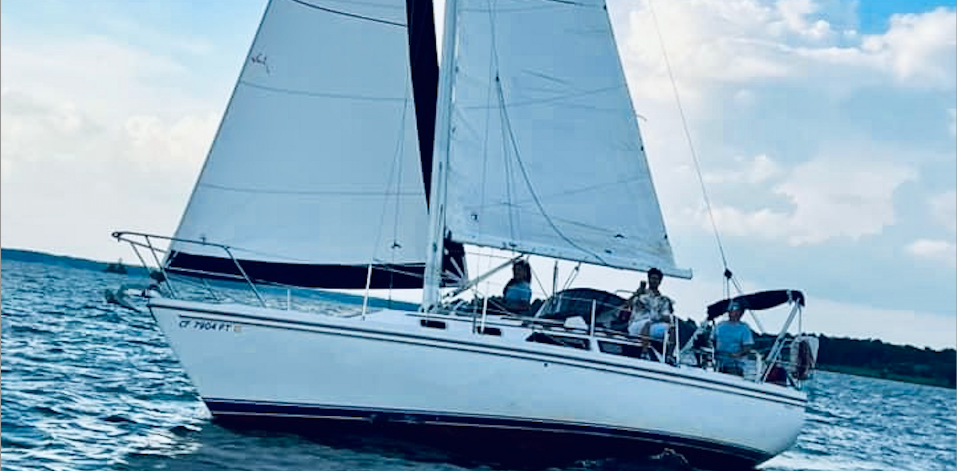 A photo of a group of people on a boat and sailing tour.