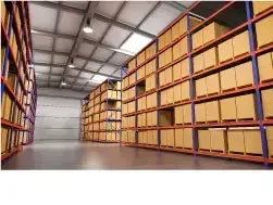 Storage warehouse that has tall shelves on both sides with cardboard boxes