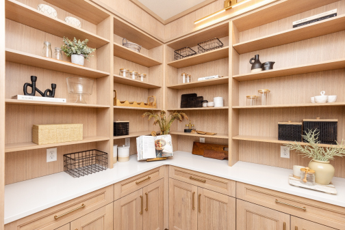 Wraparound counters, open shelving and lower cabinetry turn the pantry into a complete working space. 