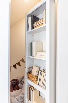 A bookcase conceals a small play nook—a charming detail tucked into the children’s spaces. 

