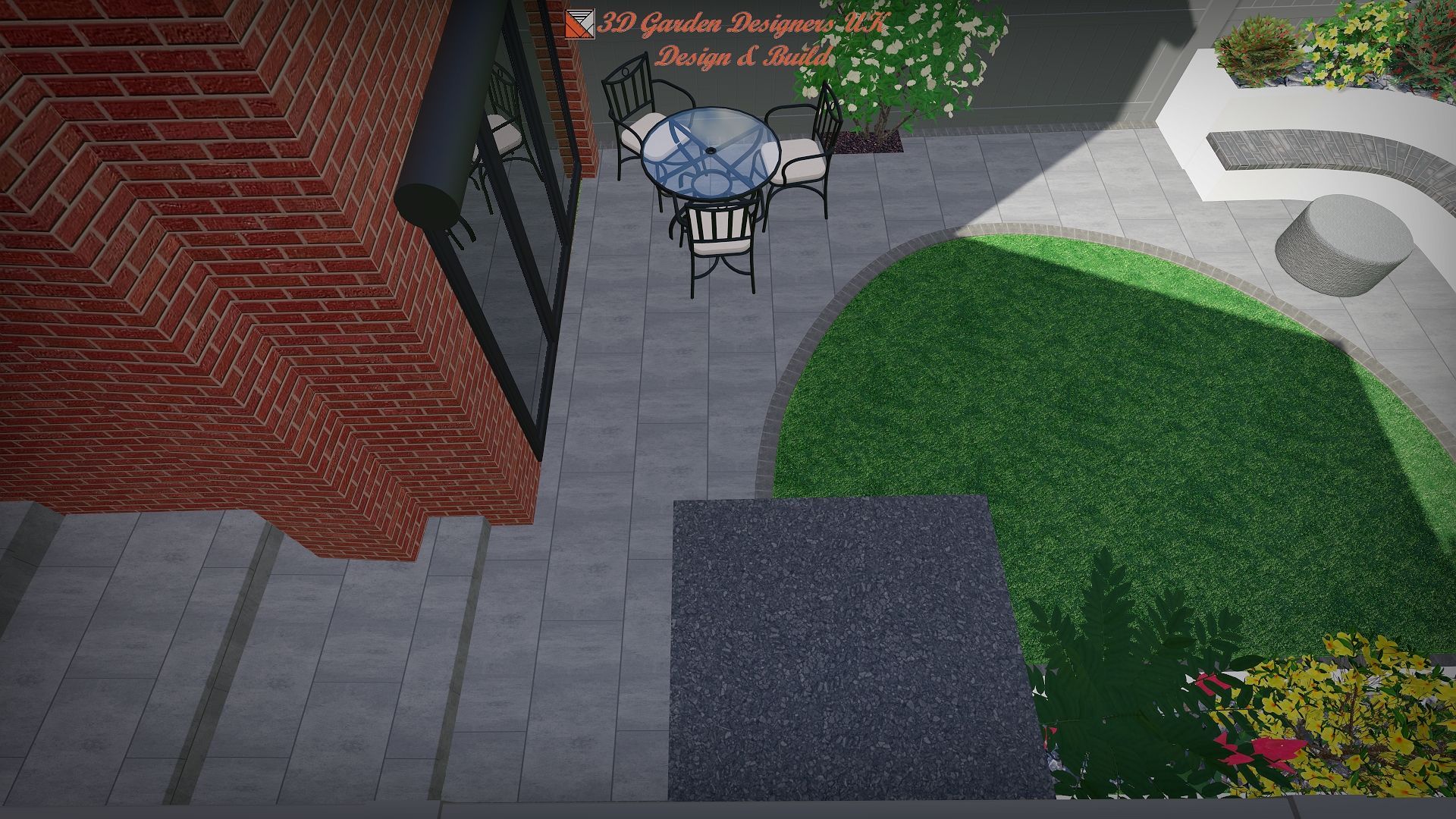 Overhead view of a patio with a table and chairs, brick wall, and green lawn.