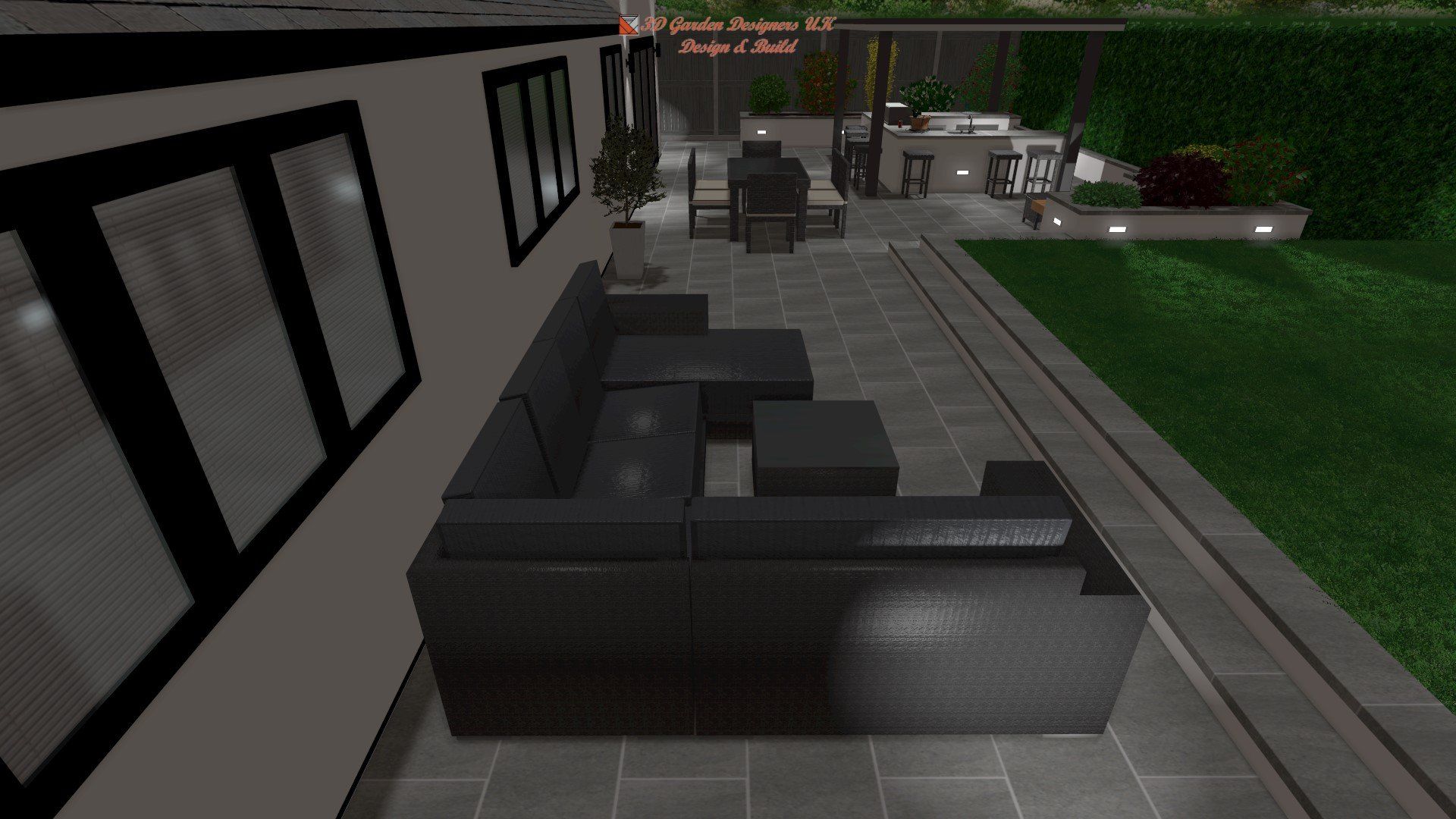 Outdoor patio with dark grey sectional sofa, table, and grill.
