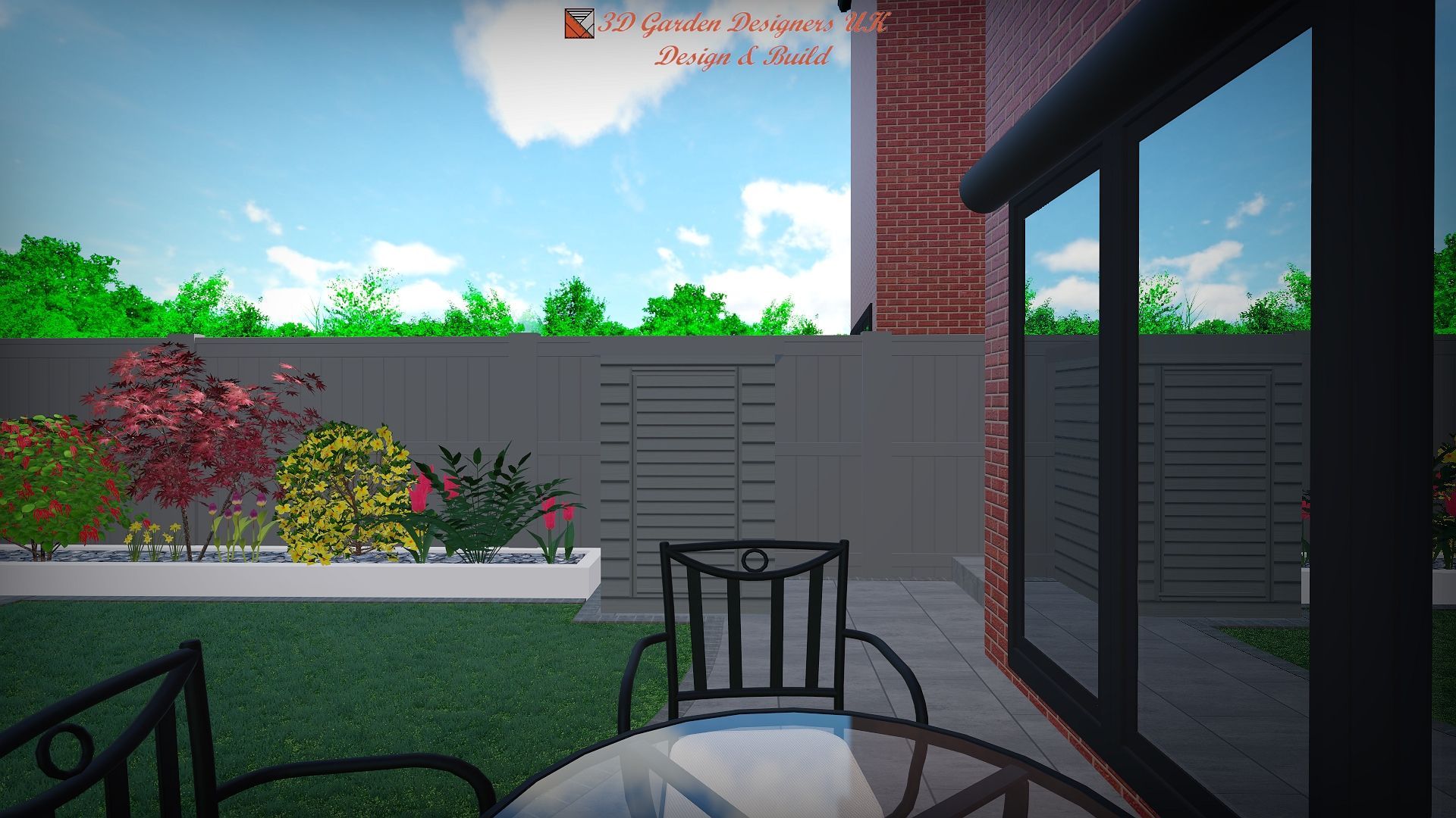 Backyard with table, chairs, flower bed, and sliding glass doors against a brick building and a green lawn.