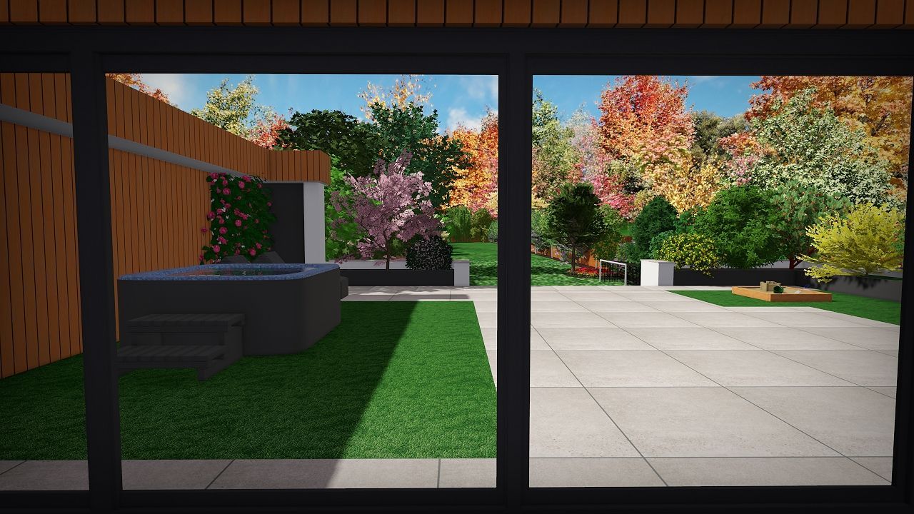 View through a window of a backyard with a hot tub, patio, lawn, and trees with autumn foliage.