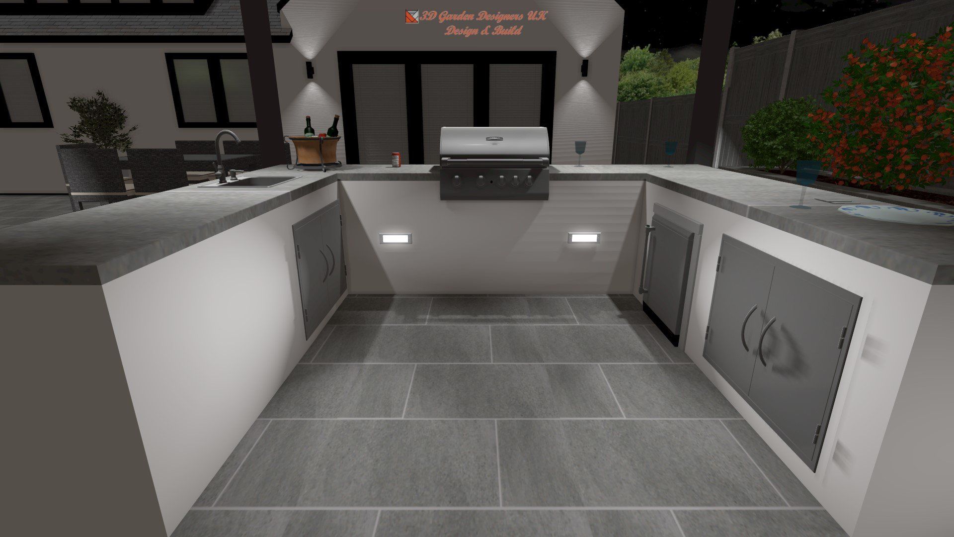 Outdoor kitchen with built-in grill, countertops, and storage. Gray tile floor and overhead lighting.