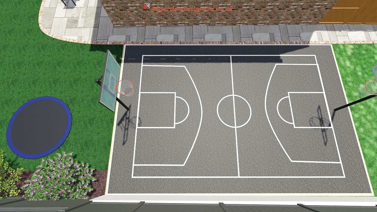 Overhead view of a backyard with a basketball court, trampoline, and brick wall.