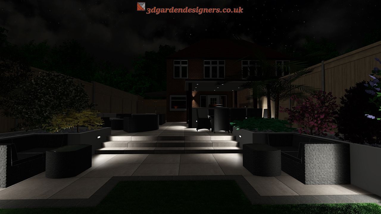 Night view of a backyard with patio furniture, lit walkways, and house in the background.
