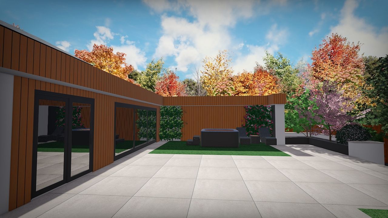 Modern patio with wood siding and large windows, surrounded by colorful trees under a blue sky.