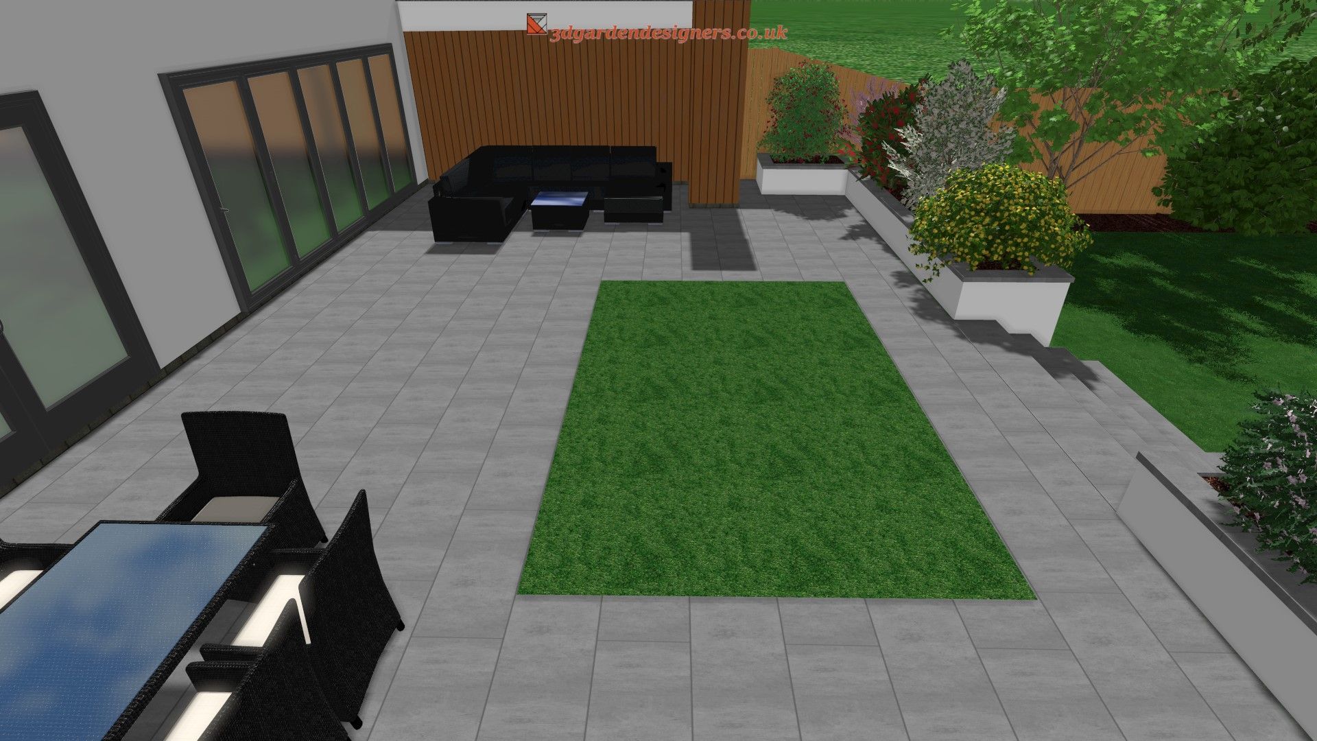 Patio with outdoor furniture, lawn, and planters. Gray paving, black seating, brown fence, and green grass.
