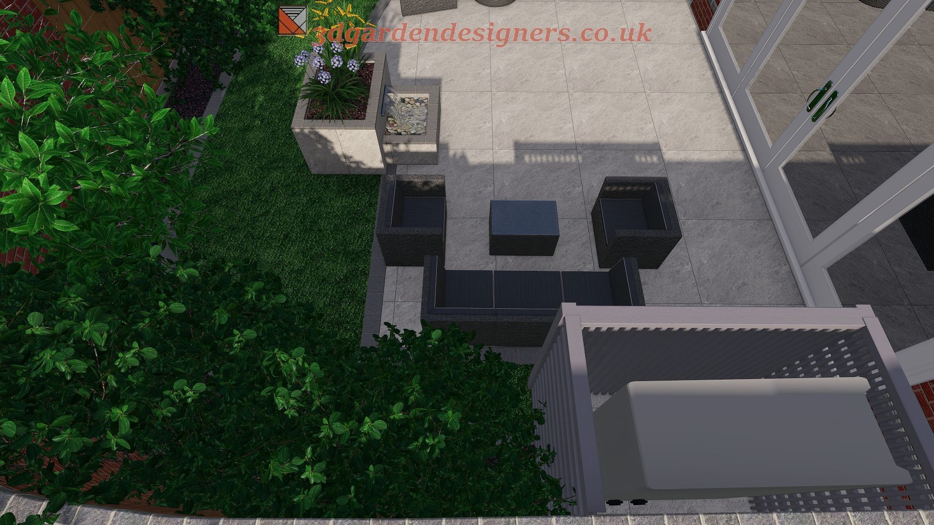 Overhead view of a modern patio with dark grey furniture and a small table, next to a building and greenery.