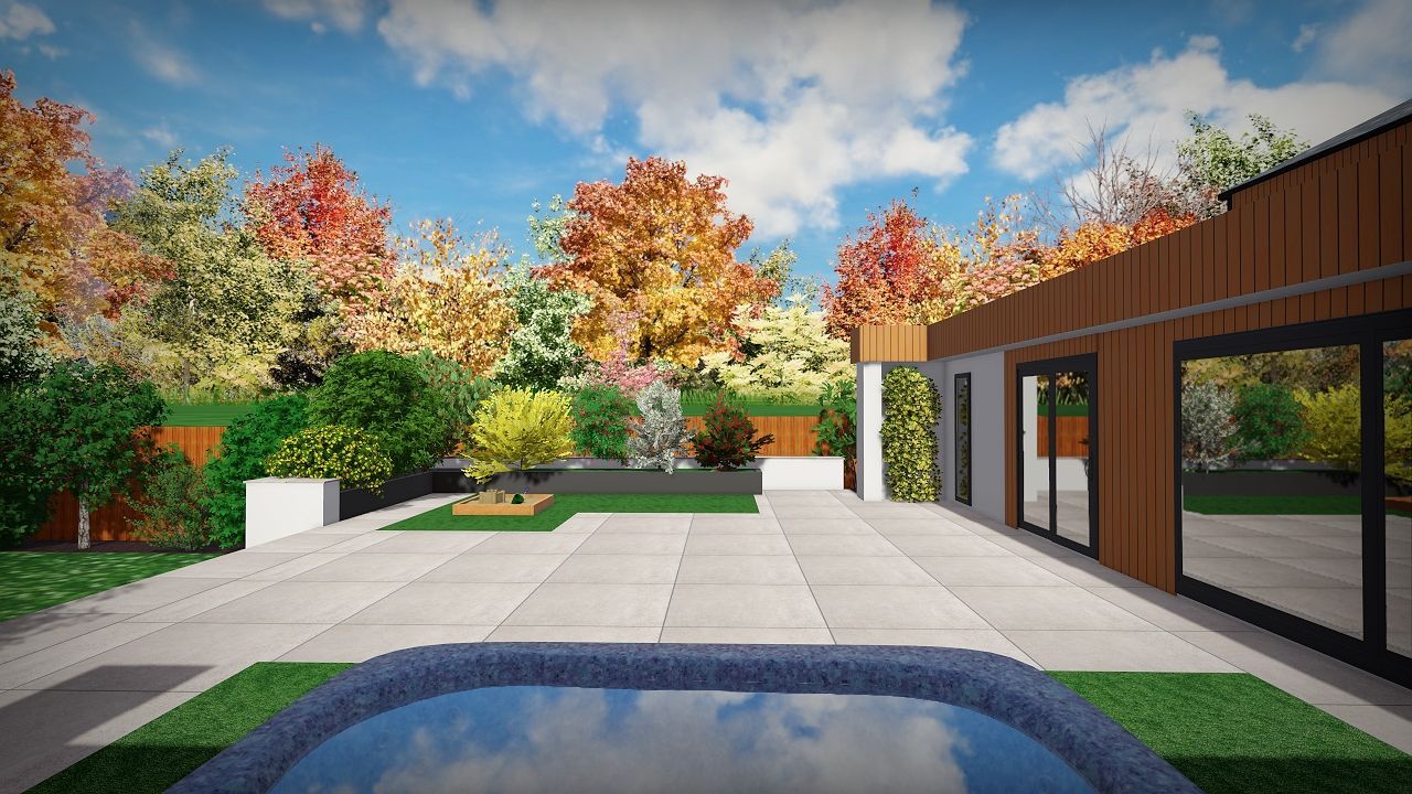 Backyard patio with pool, green grass, and colorful autumn trees.