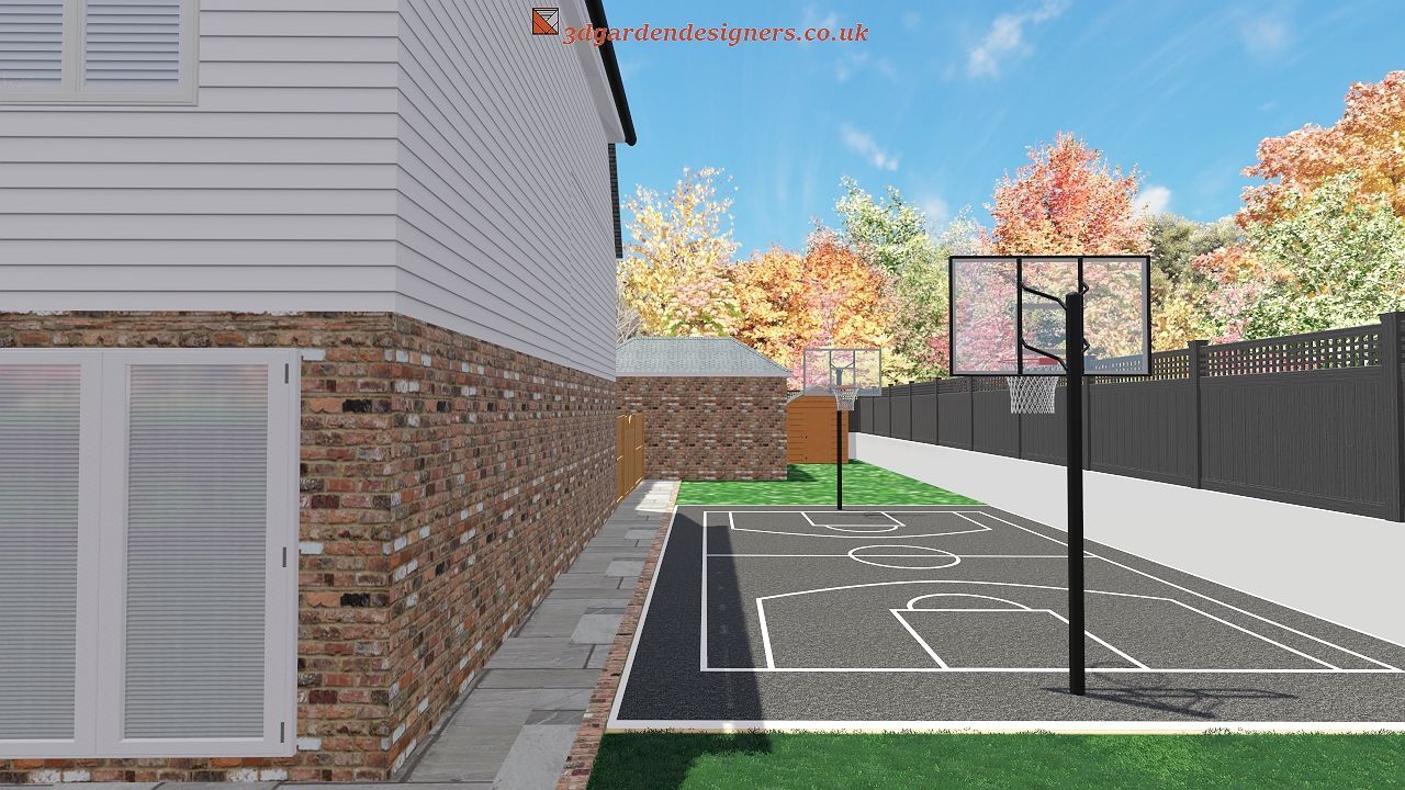 Basketball court next to a house with a brick and white siding. Trees and sky in the background.