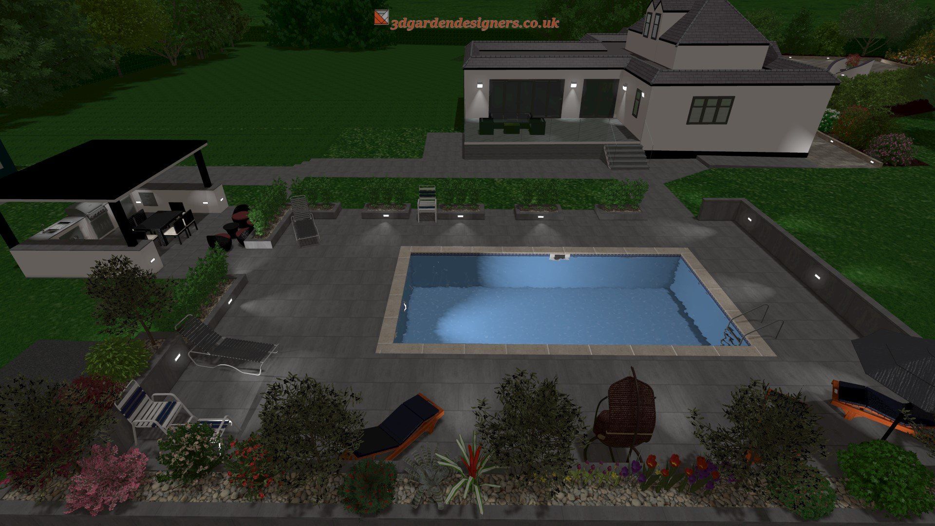 A nighttime view of a modern house with a pool and outdoor kitchen; the pool is lit.