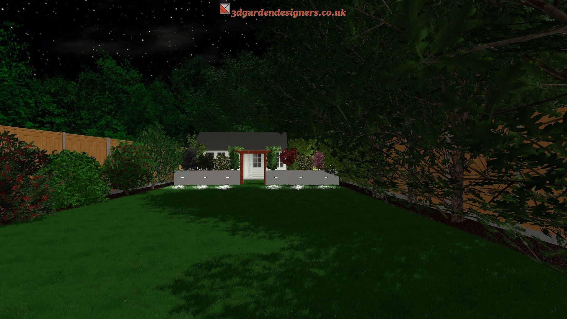 Nighttime view of a house with a green lawn, surrounded by trees and a wooden fence.
