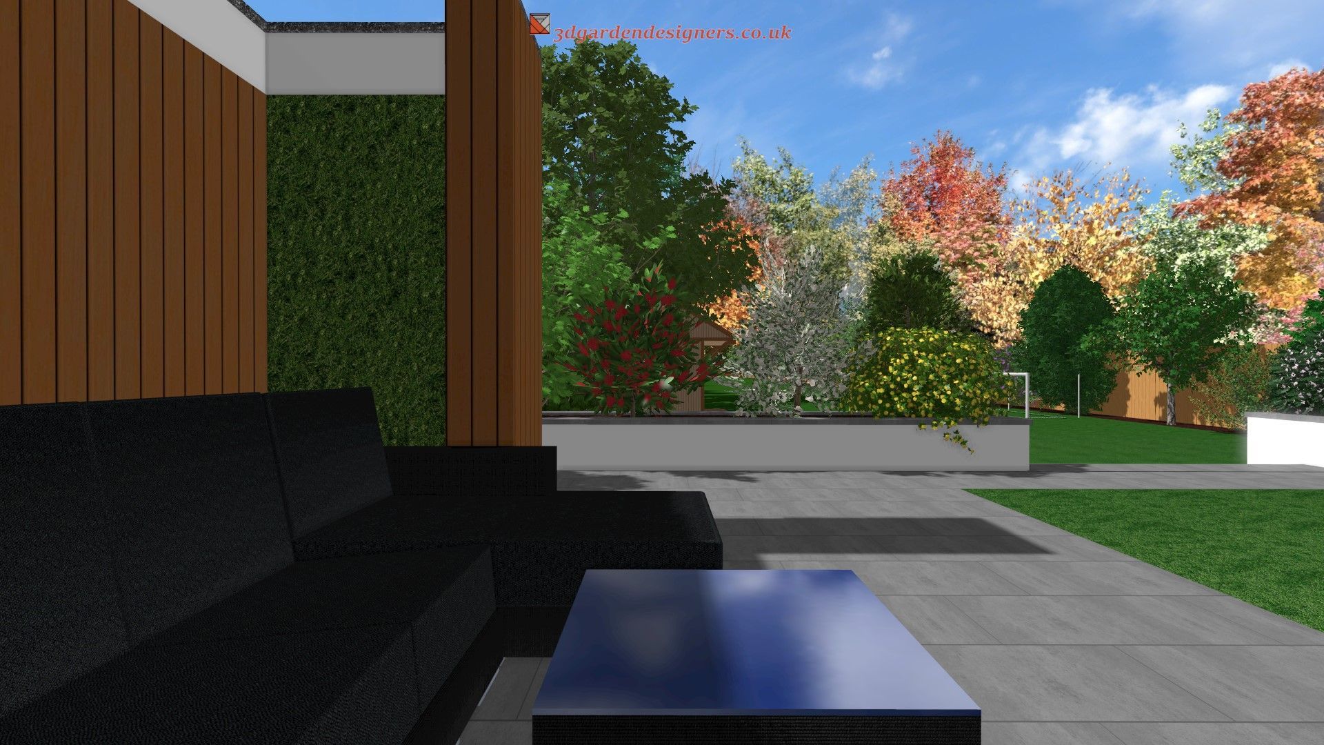 Outdoor patio with black sofa, dark coffee table, and lush garden in the background under a blue sky.