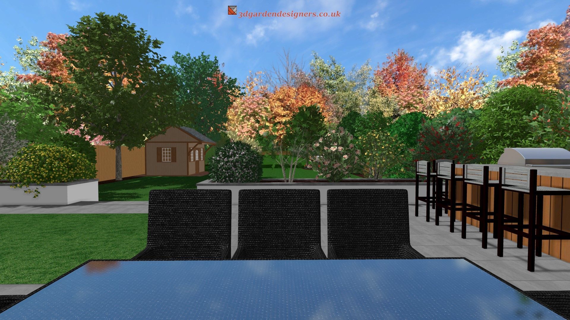 Backyard scene with a reflecting pool, dark stone wall, and colorful trees.