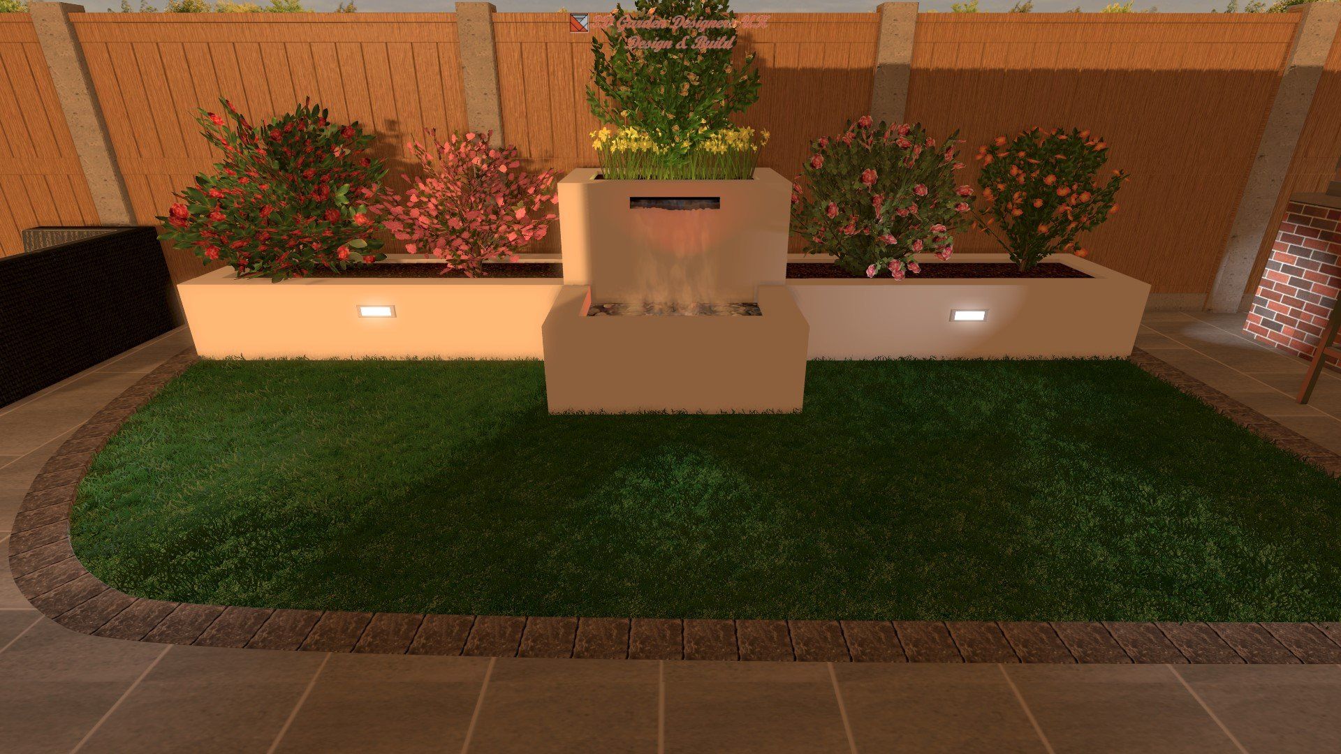 A lush green lawn with a water fountain and flower planters, set against a wooden fence.