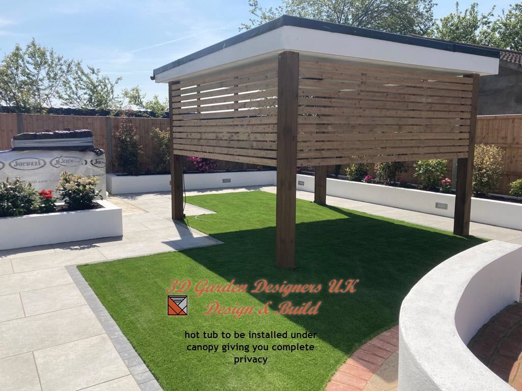 Garden with artificial turf, a wooden pergola, and a patio area.