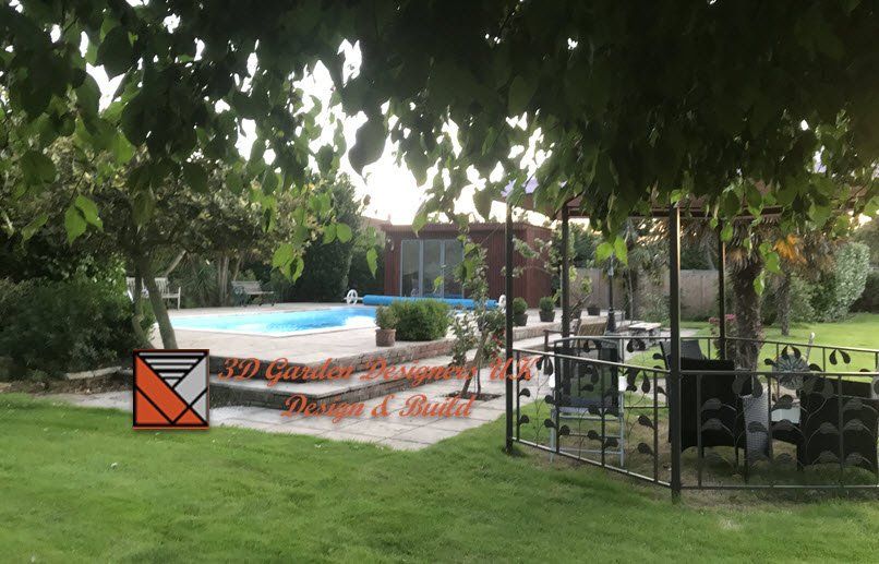 Backyard with pool, trees, grass, and a decorative orienteering marker.