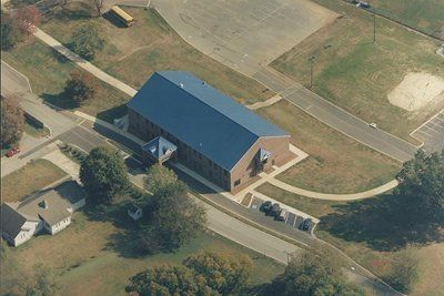 An aerial view of a building with a blue roof