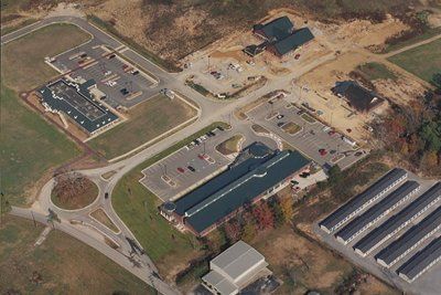 An aerial view of a large industrial area with lots of buildings and parking lots