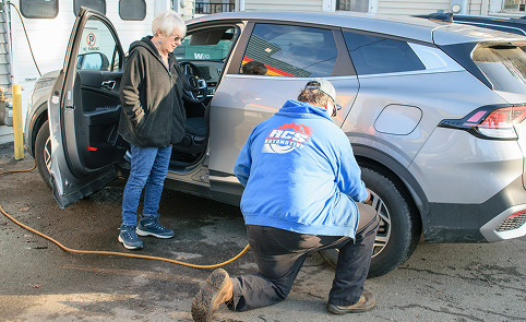 Technician repairing tire for customer | RCS Automotive