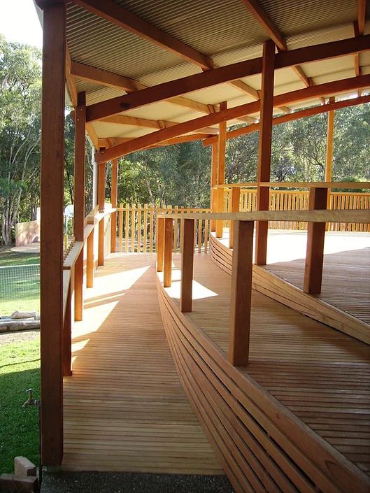 A Wooden Deck With a Ramp Leading to It — D.J. Decks in Sawtell, NSW