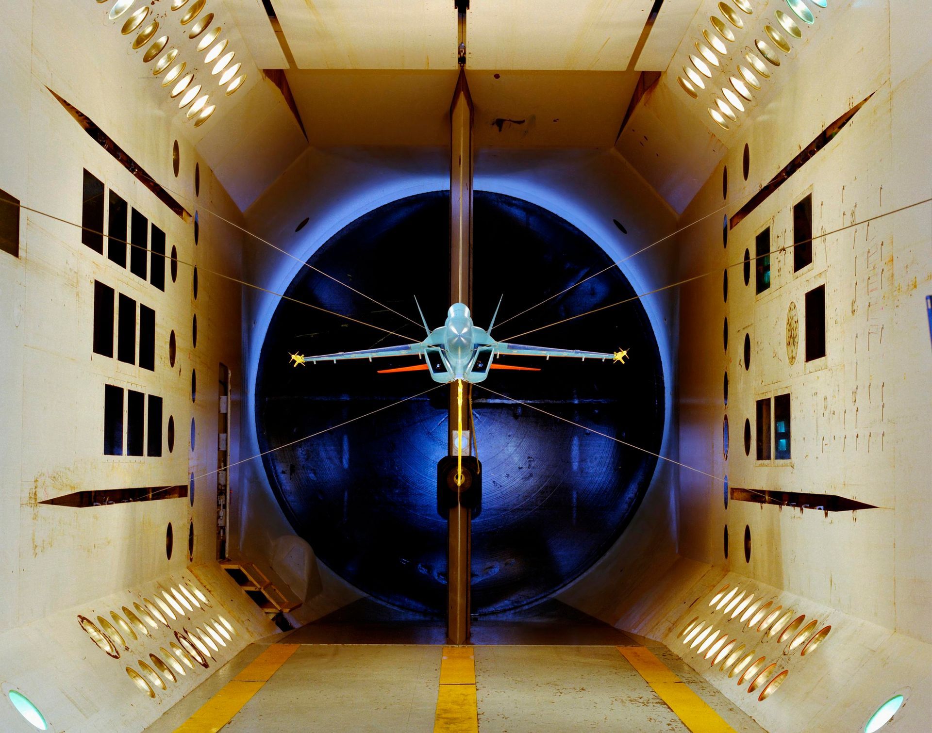 A model airplane is being tested in a tunnel.