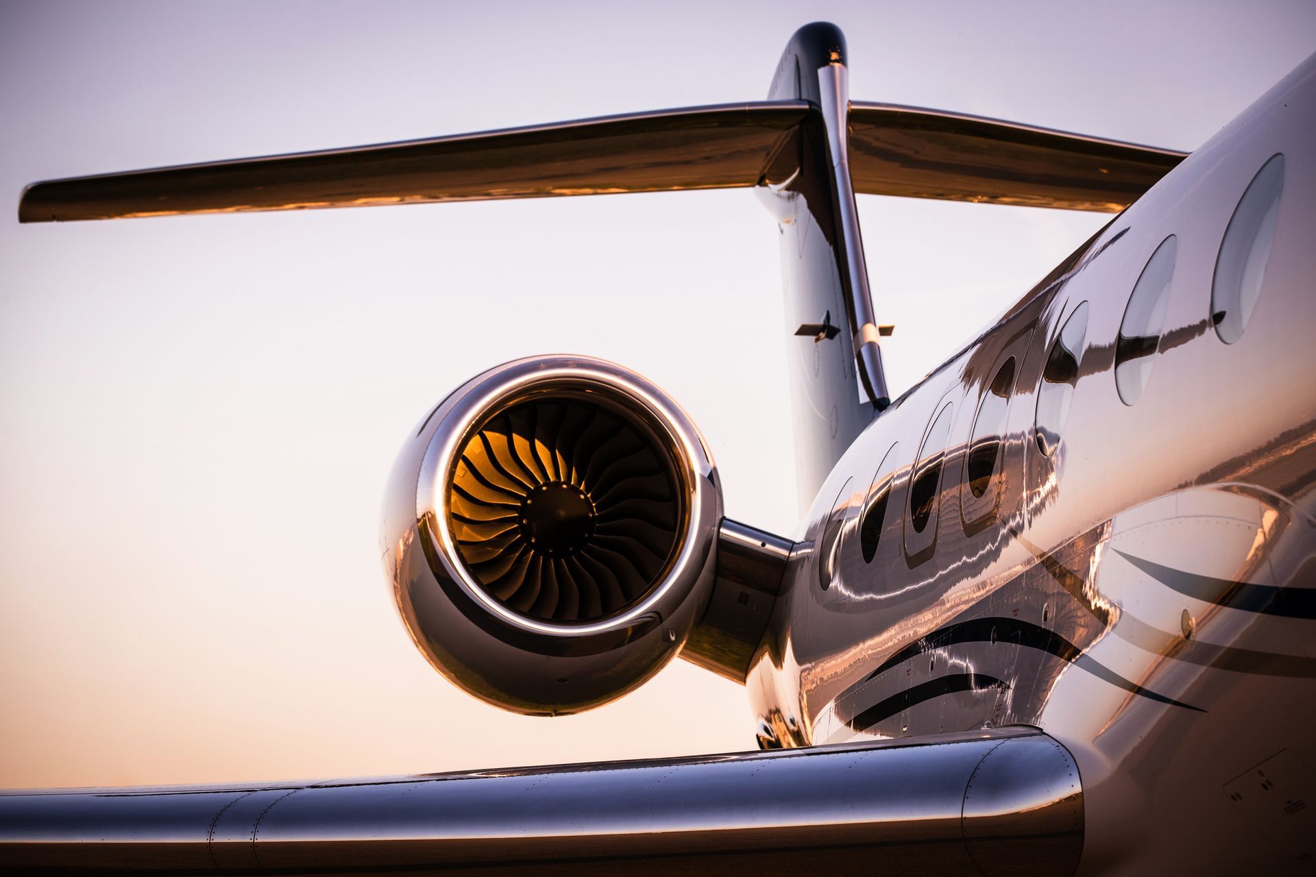 A close up of a plane 's engine and wing.