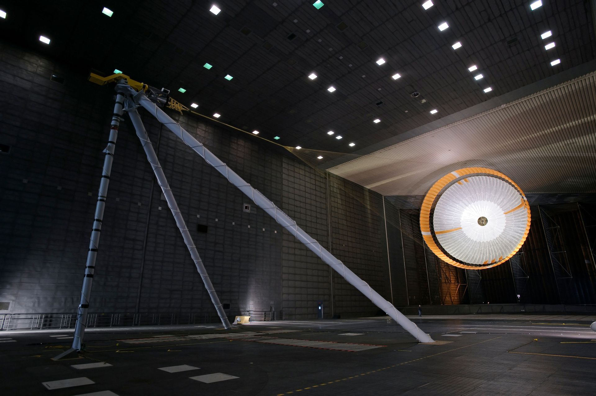 A large circular object is in the middle of a dark room.