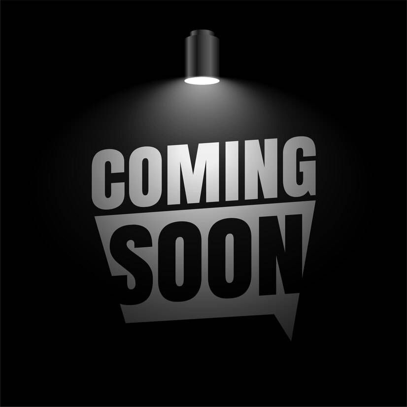 A light is shining on a sign that says `` coming soon ''.