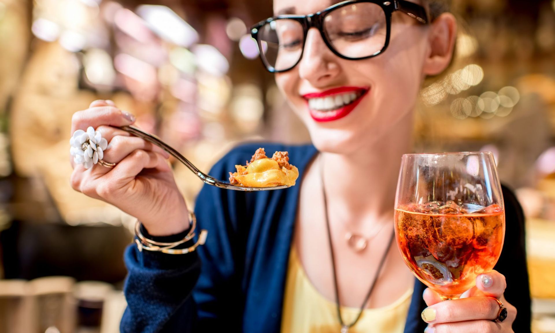 Woman having a meal and a drink