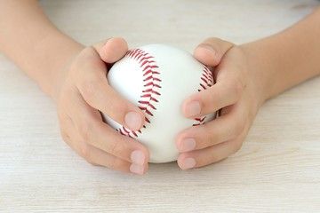 Hands holding a Baseball