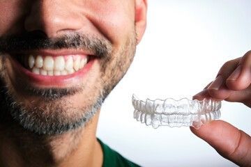 Man holding Clear Aligners