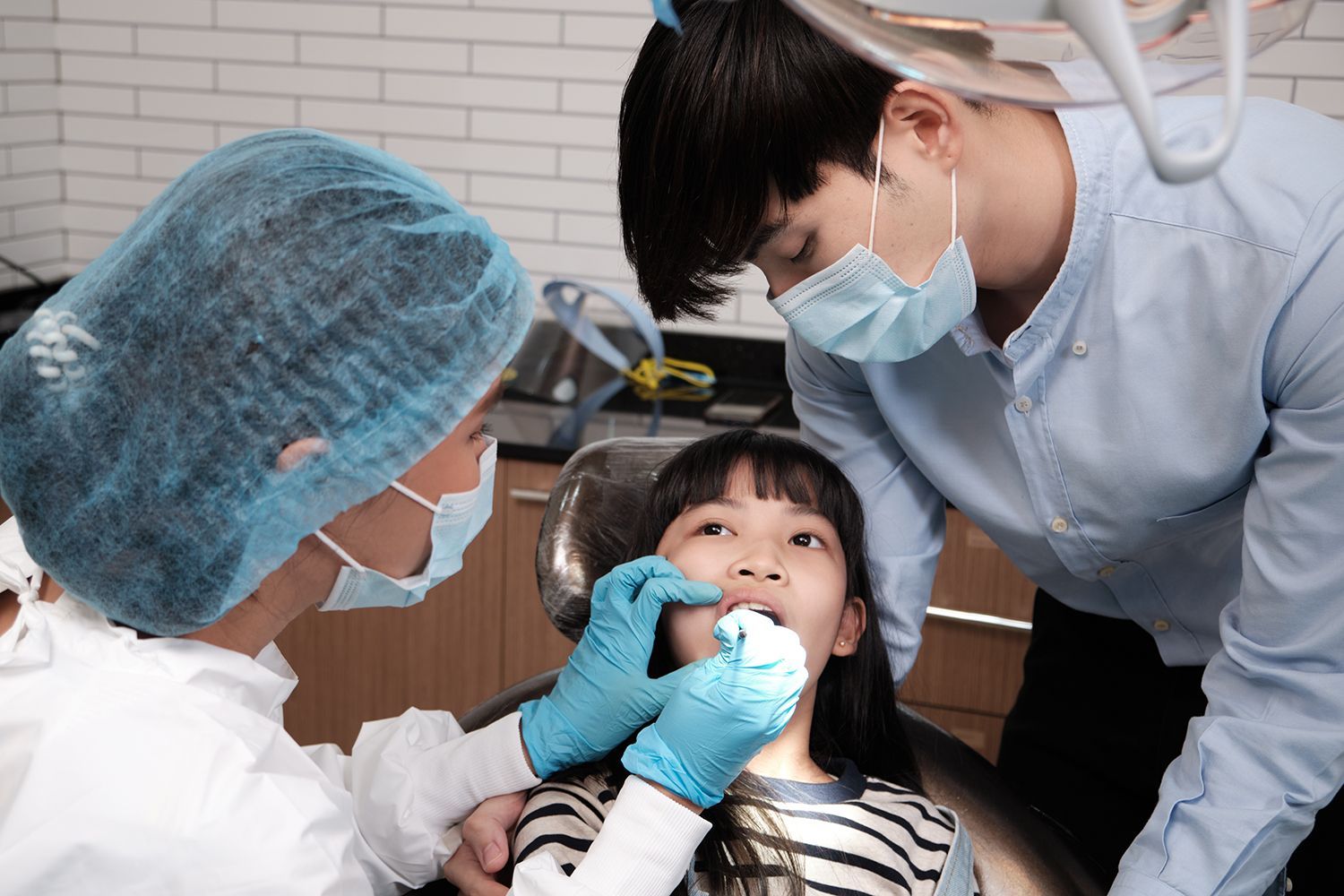 A Girl undergoing dental checks and procedures