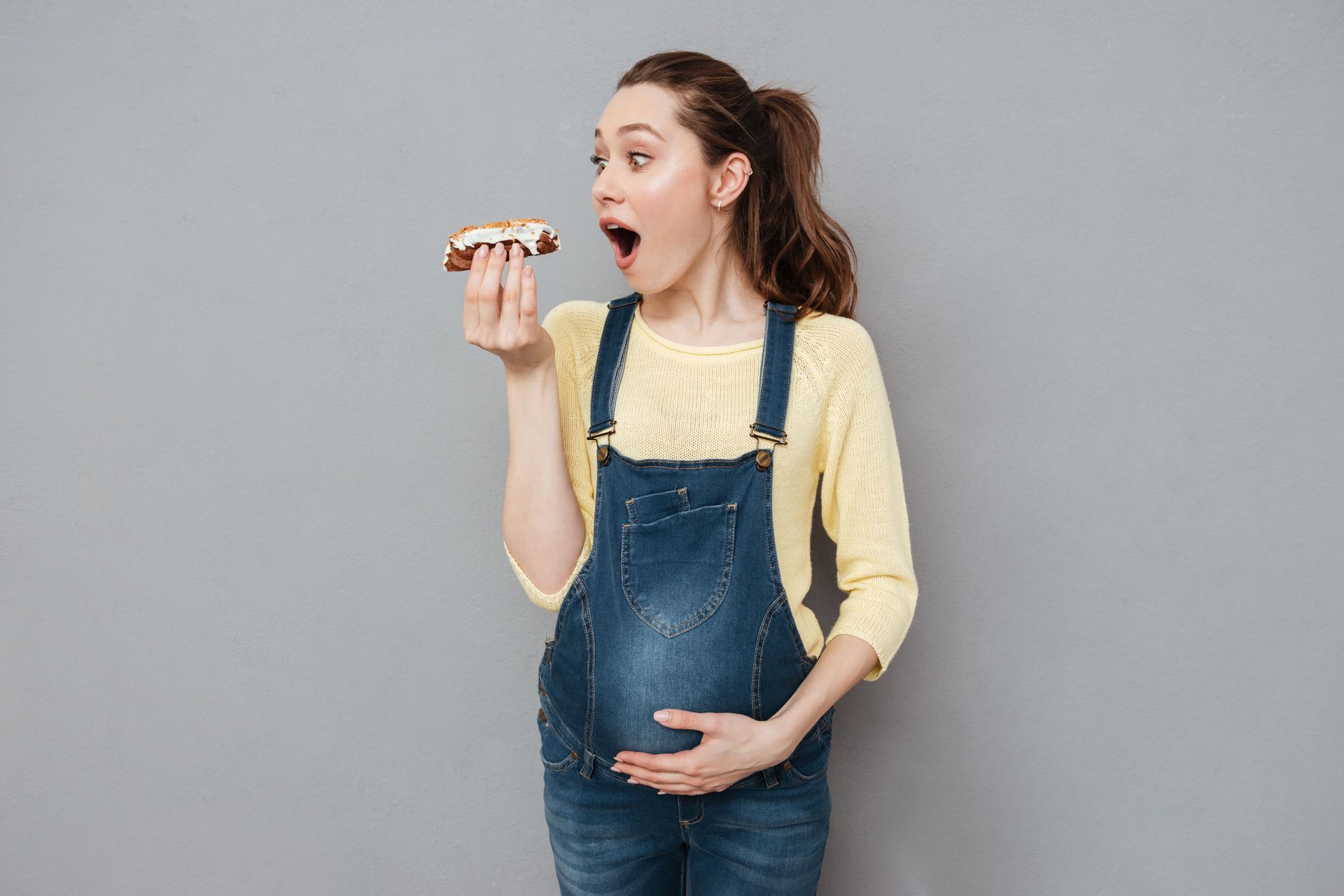 Pregnant Woman eating Sweets