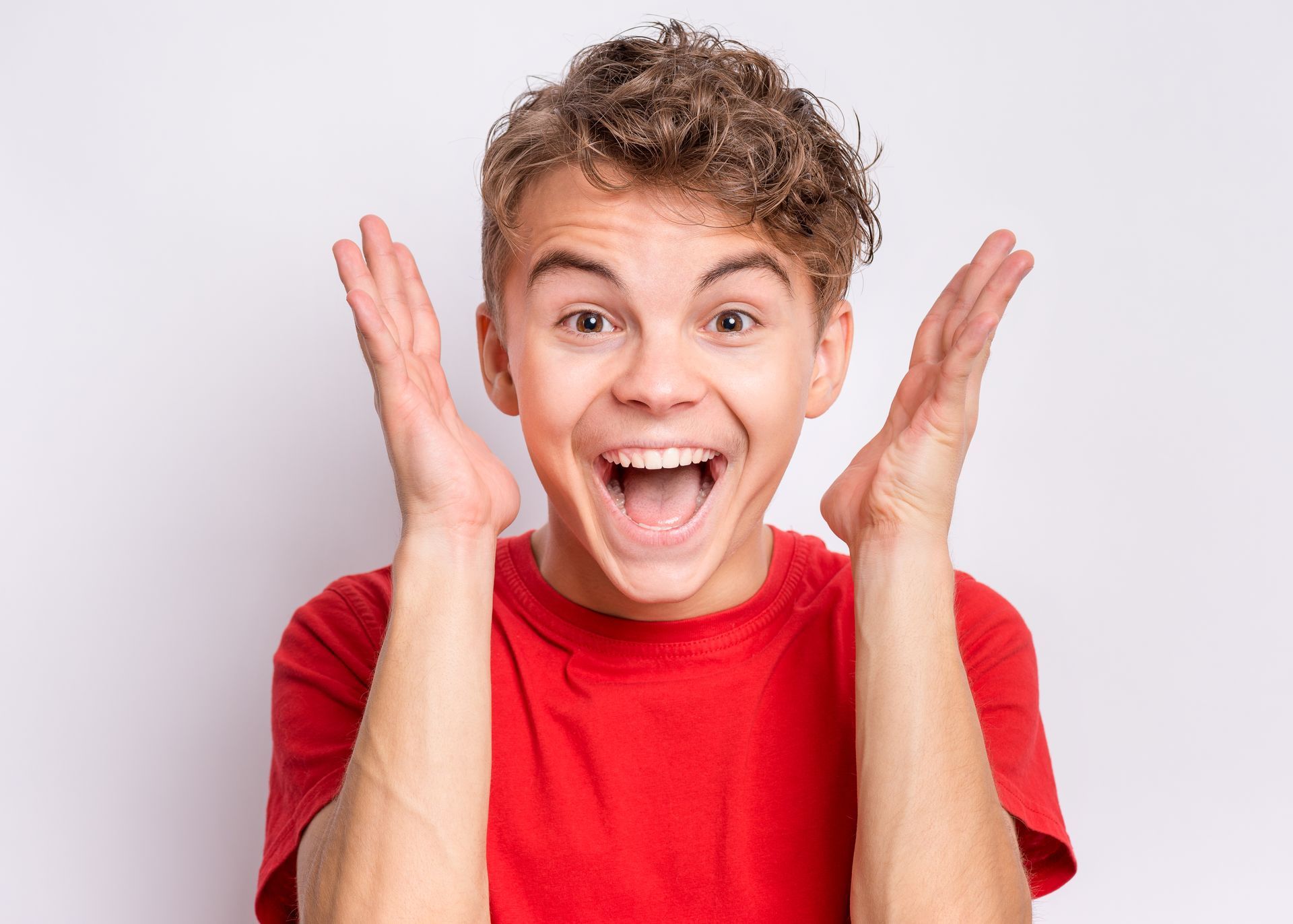 A surprised Boy in a red shirt