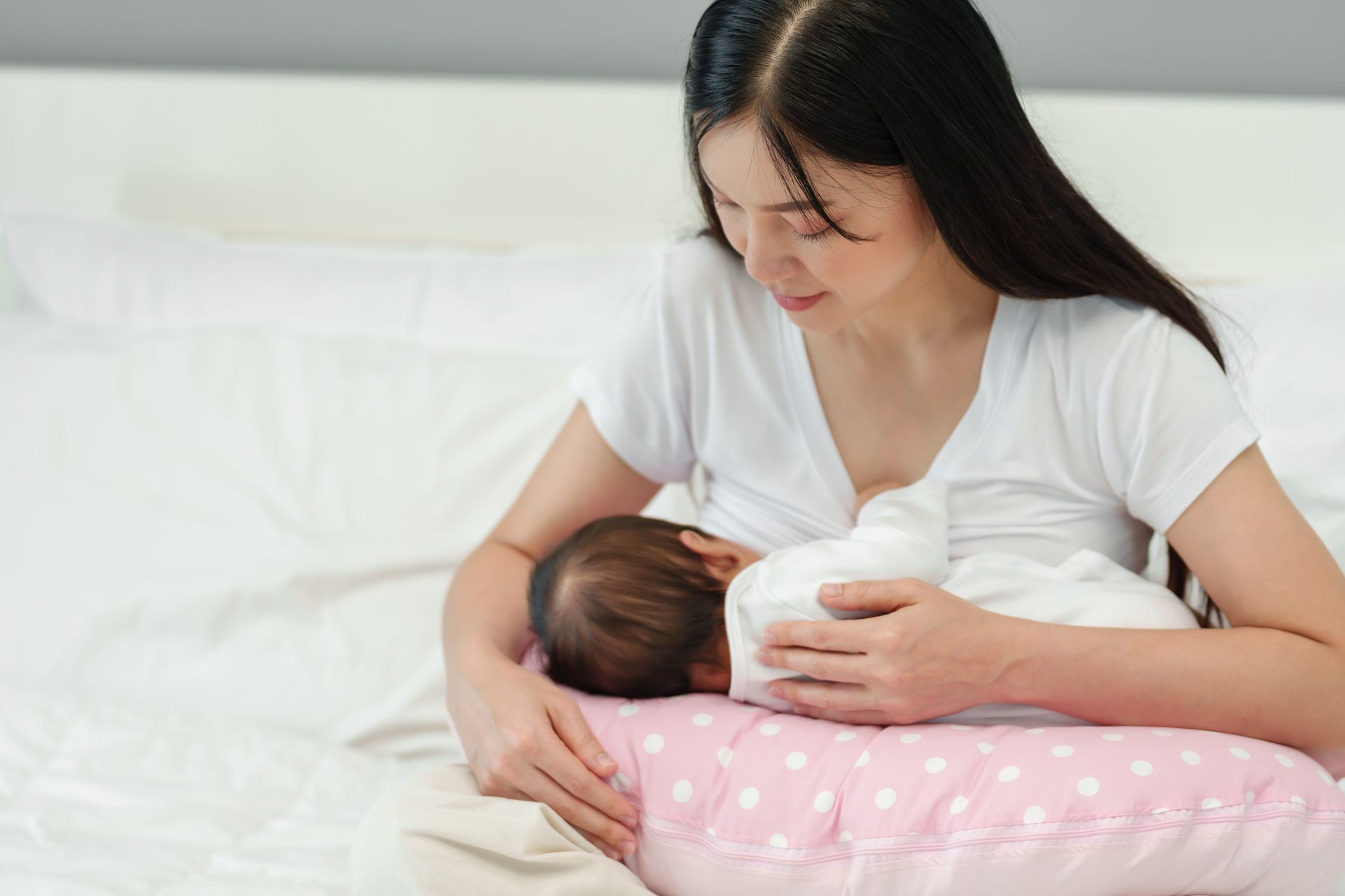 Mother Breast Feeding her Child